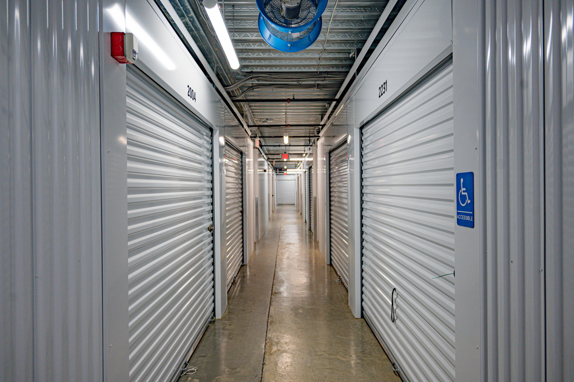 Interior climate-controlled storage corridor with roll-up unit doors at Cubesmart Self Storage